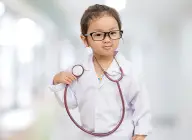 Adorable kid posing as a doctor with a stethoscope, embodying the spirit of the kids health check station, emphasizing early and proactive healthcare for children.